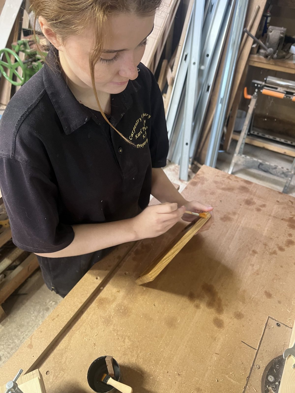 Applying oil finish to a handcrafted oak piece at KMP’s Cambridgeshire joinery workshop — attention to detail and quality finish.