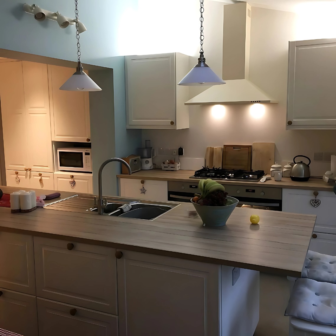 Fitted kitchen installation with bespoke cabinetry and timber worktops in a Cambridgeshire home.