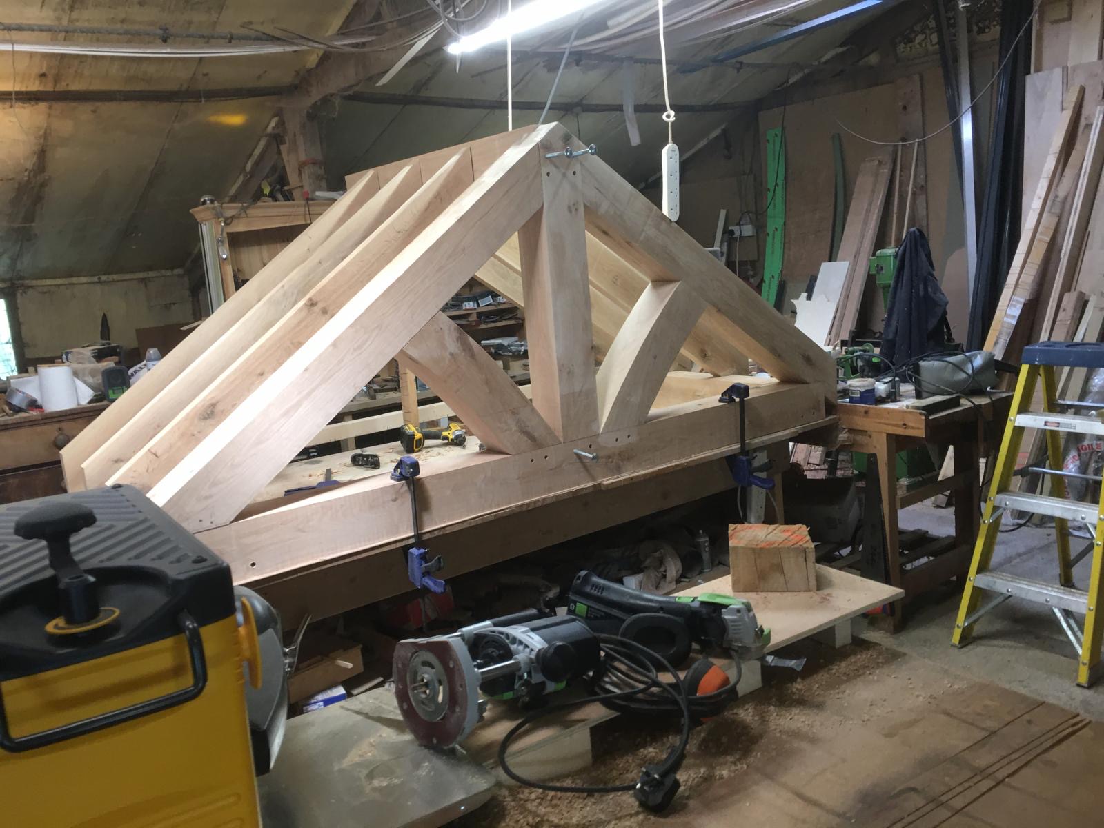 Mortise and tenon joints in oak porch frame during construction in Cambridgeshire workshop.