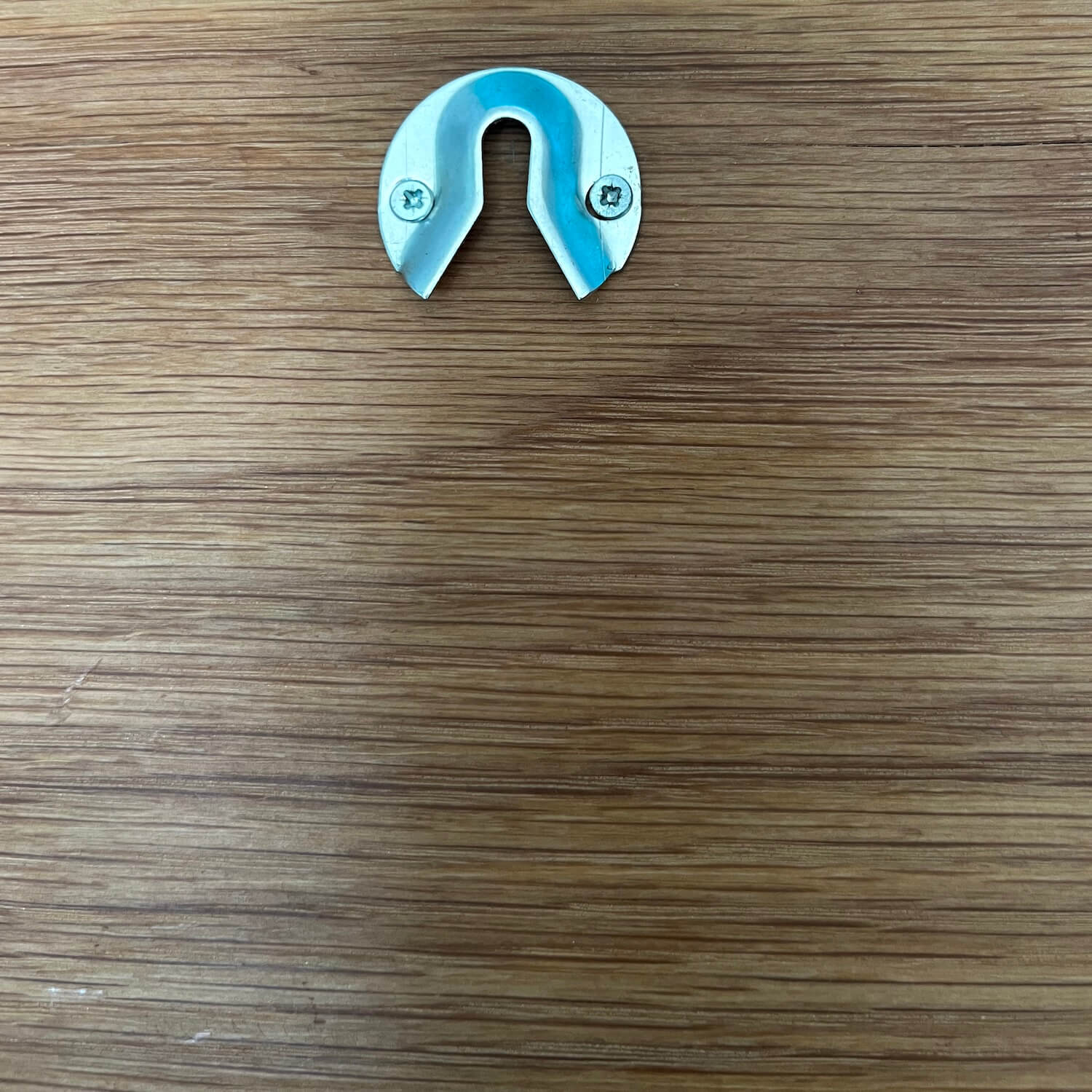 Back view of personalised oak sign showing secure wall hanging hardware.