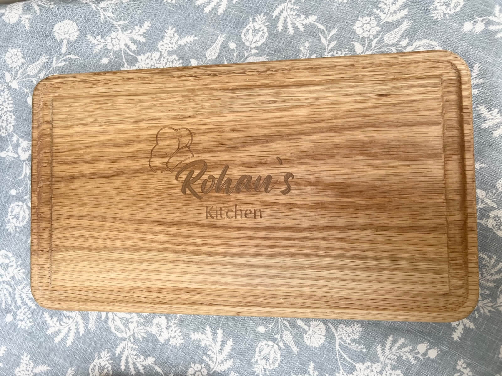 Custom oak chopping board overhead view, engraved and handcrafted in the UK.