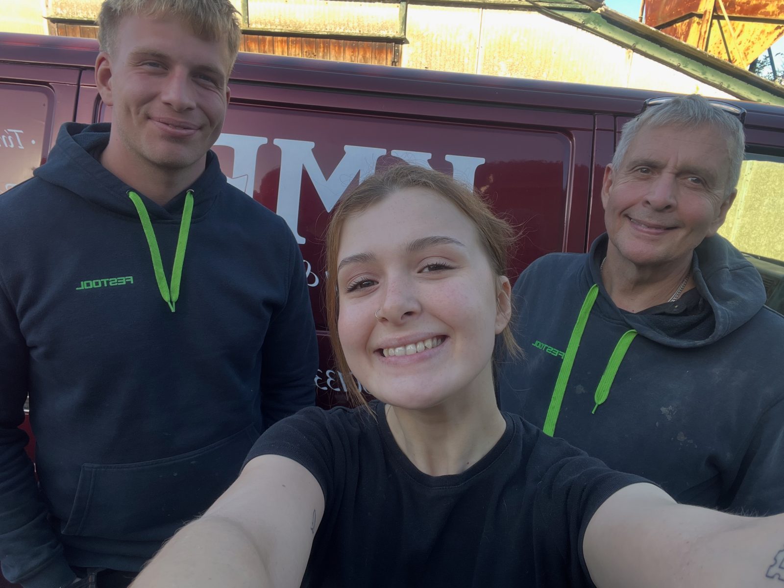 The KMP Carpentry & Joinery team smiling outside their Cambridgeshire workshop — a family-run joinery business built on craftsmanship, quality and care.