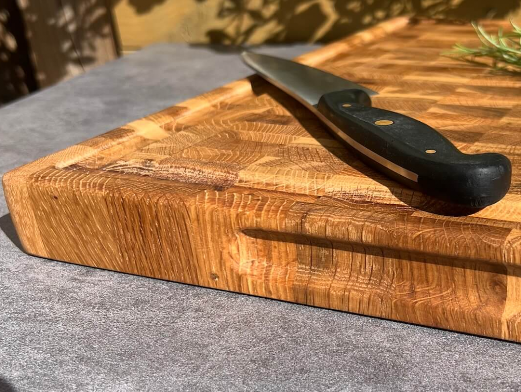 Personalised end grain oak chopping board with knife — engraved wooden gift handcrafted in Cambridgeshire, UK.