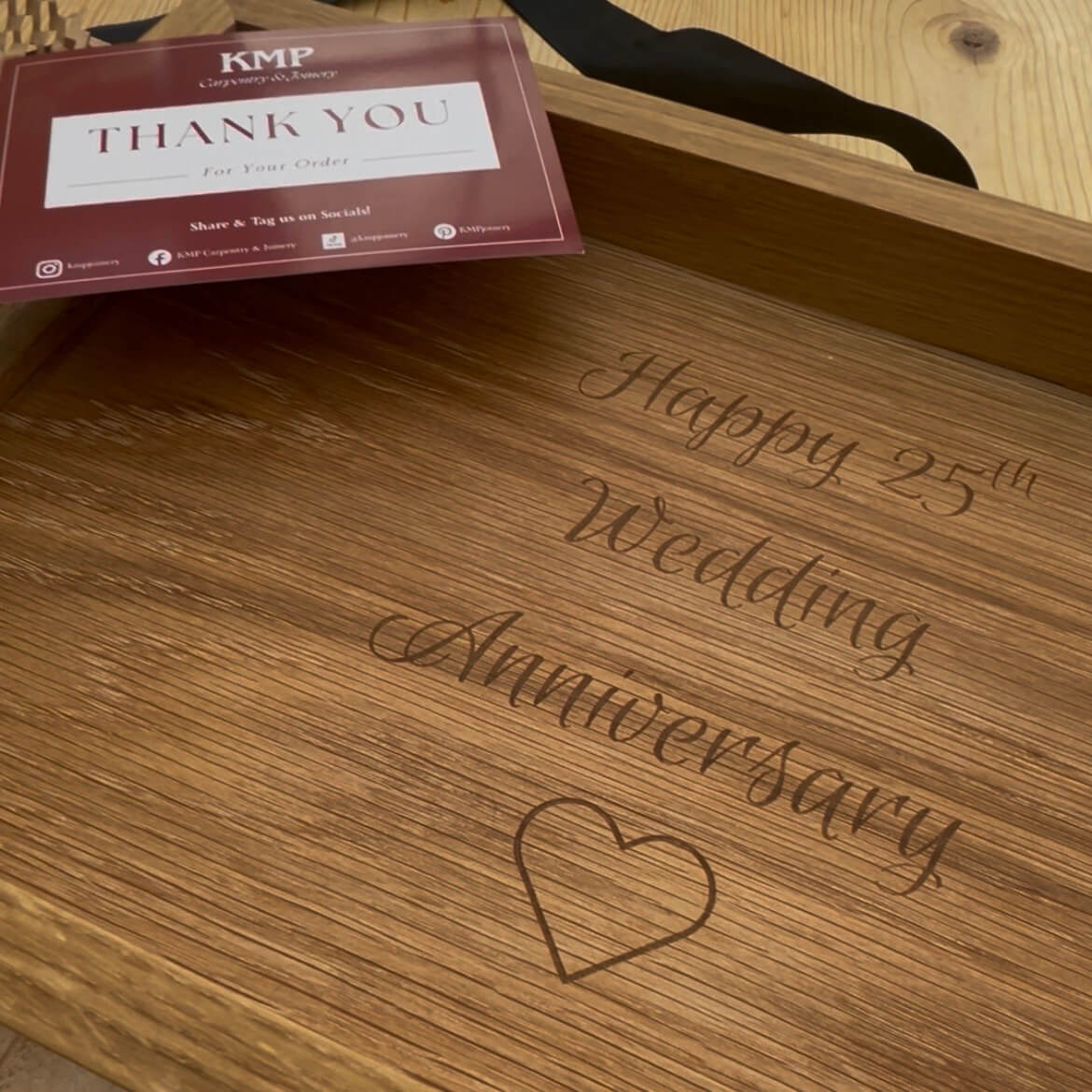 Personalised oak serving tray engraved with “Happy 25th Wedding Anniversary” and heart icon, custom wooden gift for couples.