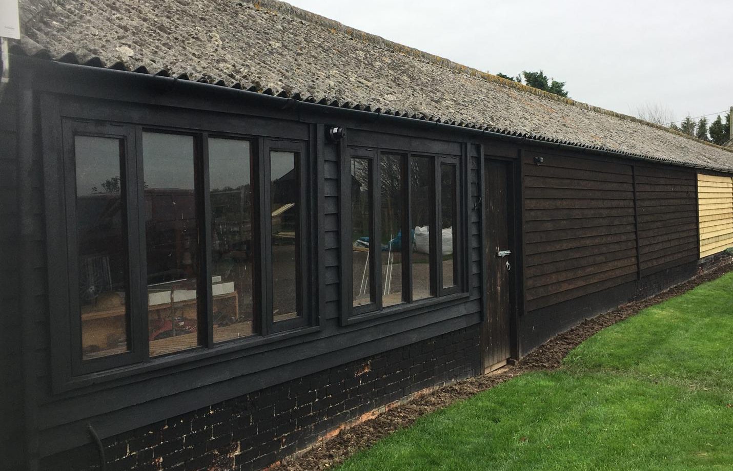 Timber-clad commercial building refurbishment completed by KMP Carpentry & Joinery.