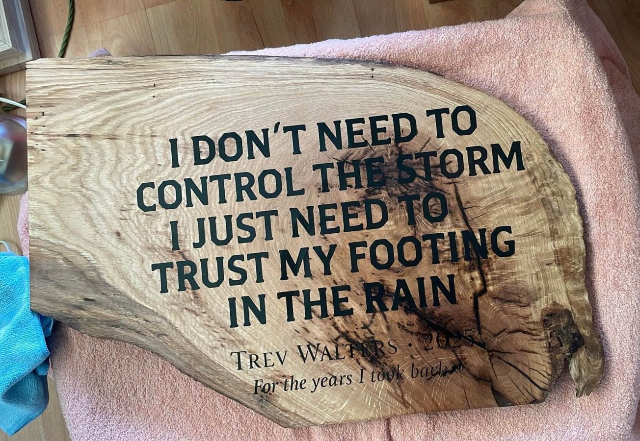 CNC engraved timber plaque with lettering and natural live edge detail.