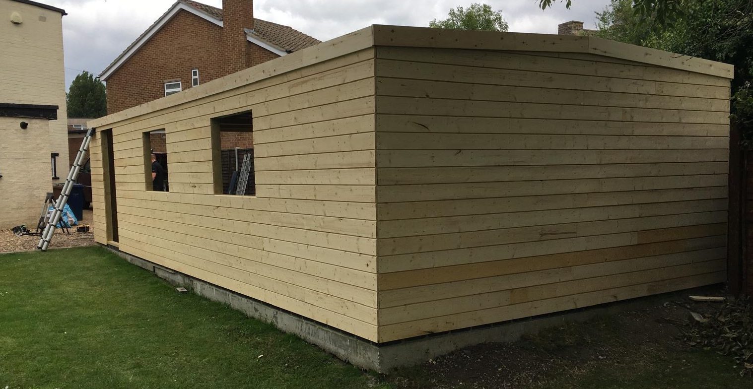 Bespoke timber garage built in Cambridgeshire with pitched roof and timber cladding.