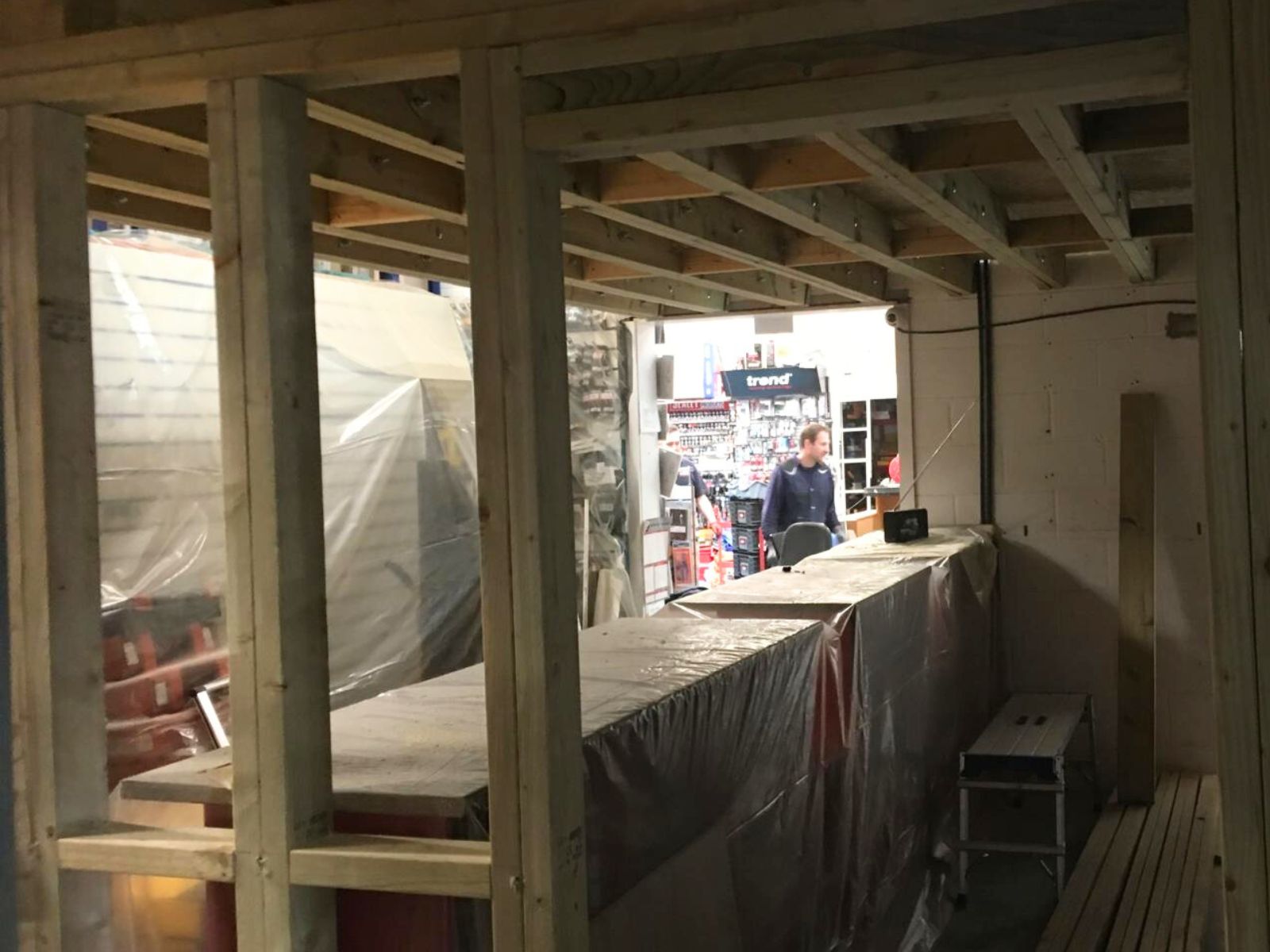 Structural timber mezzanine floor framework with joists and chipboard flooring installed during a commercial shop refurbishment in March, Cambridgeshire.