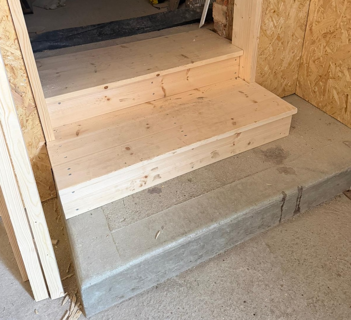 Stud wall construction and access steps during commercial kitchen fit out in Cambridgeshire.