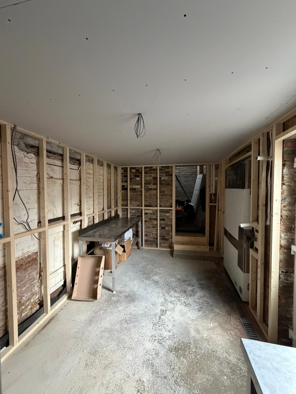 Commercial fit out project inside a working butchers shop in Cambridgeshire during prep room construction.