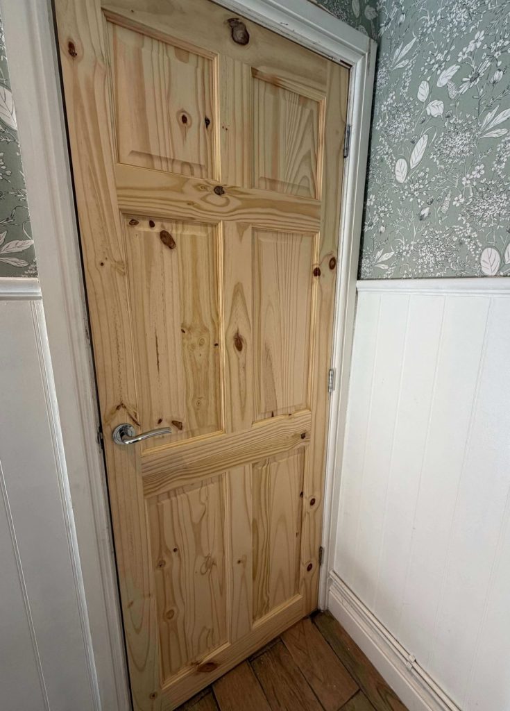Solid timber internal door fitted in a home.
