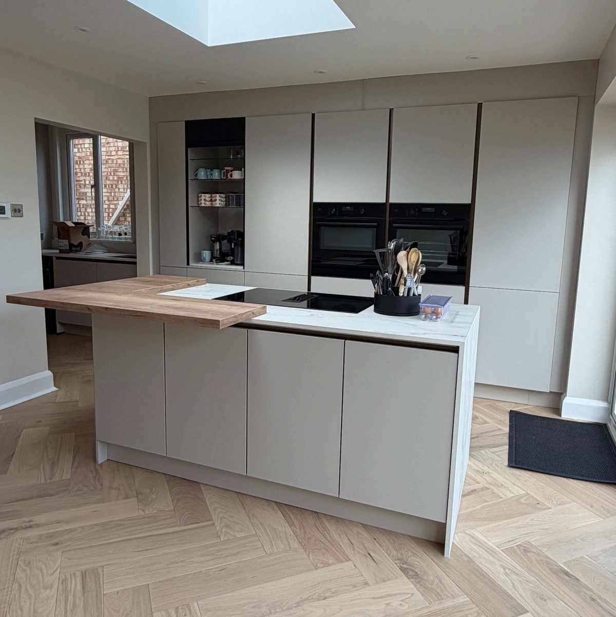 Modern kitchen with bespoke cabinetry and island unit.