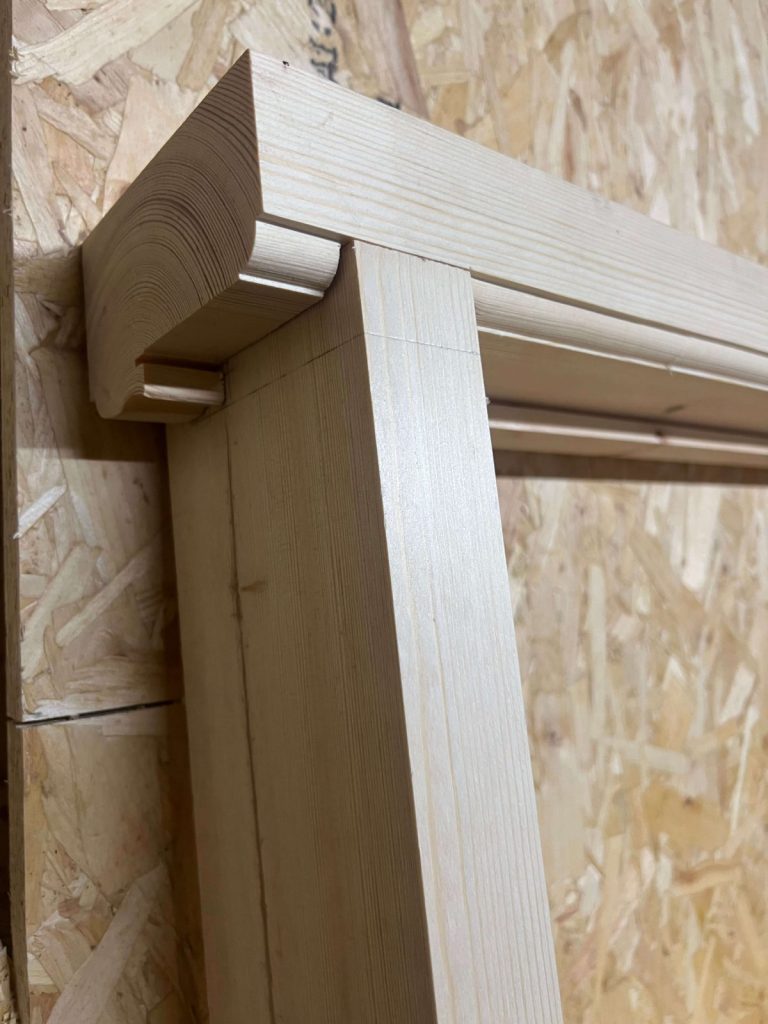 Timber window frame being crafted in joinery workshop.