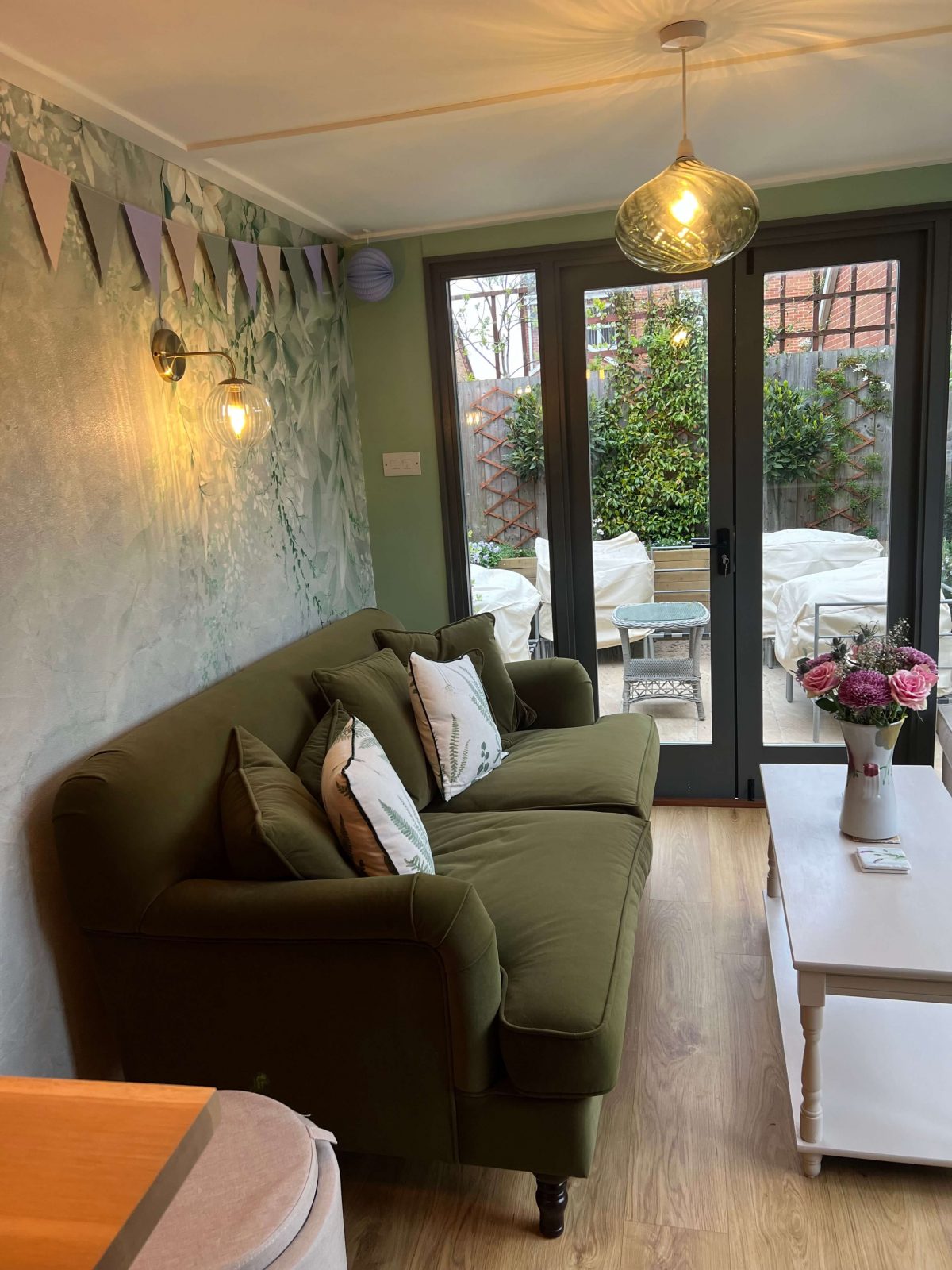Garden room interior with engineered oak flooring and patio doors in Cambridgeshire.