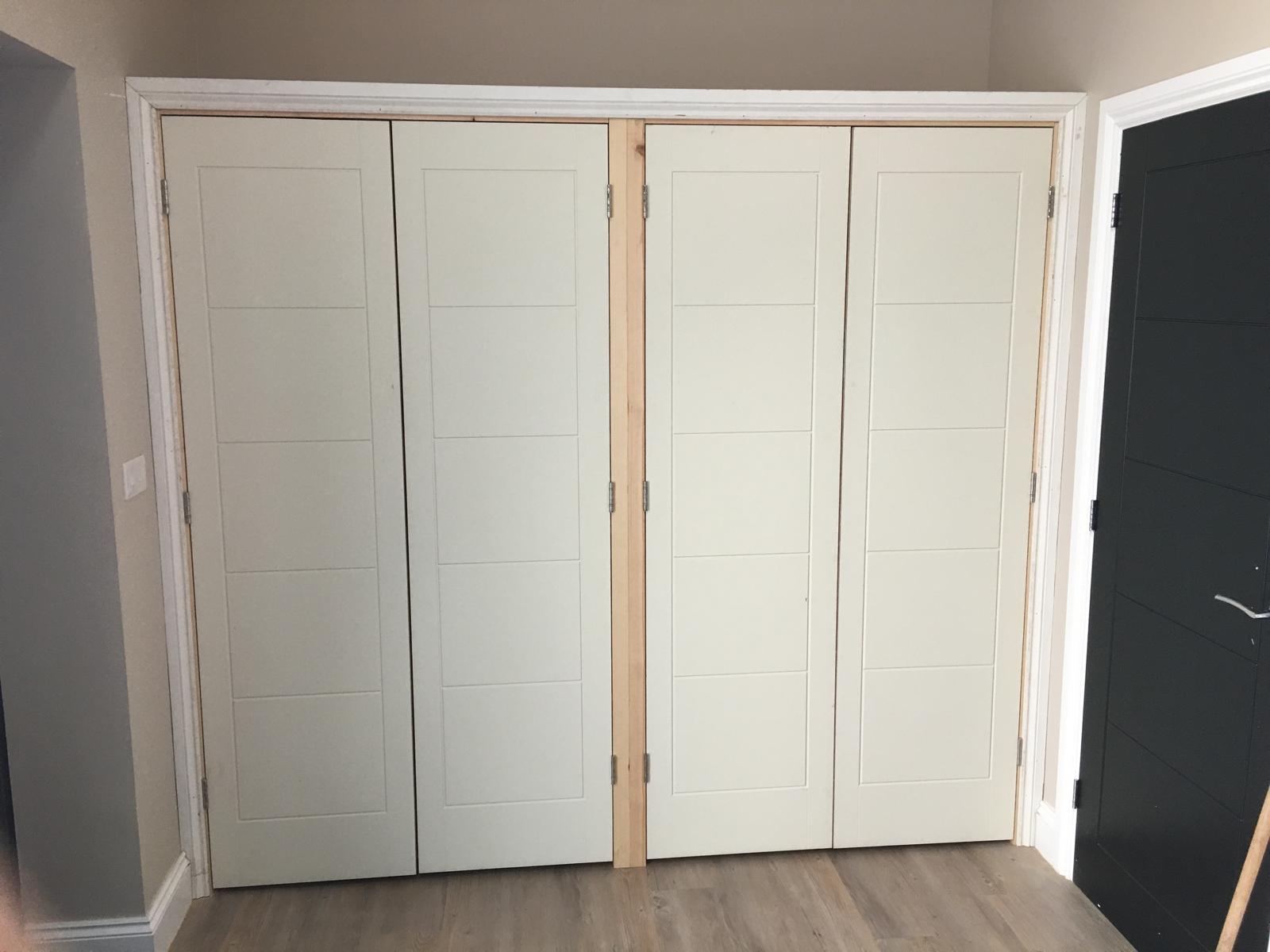 Cloakroom fitted storage with built-in cupboards for shoes and coats.