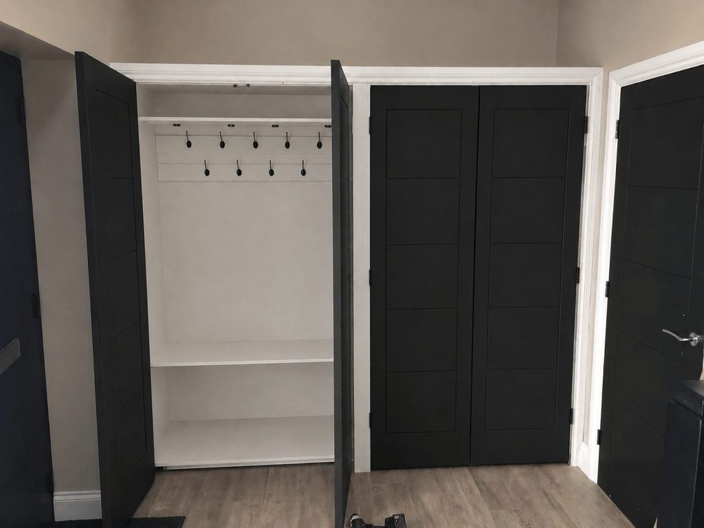 Bespoke fitted wardrobe with full-height hanging space and shelving in Cambridgeshire.