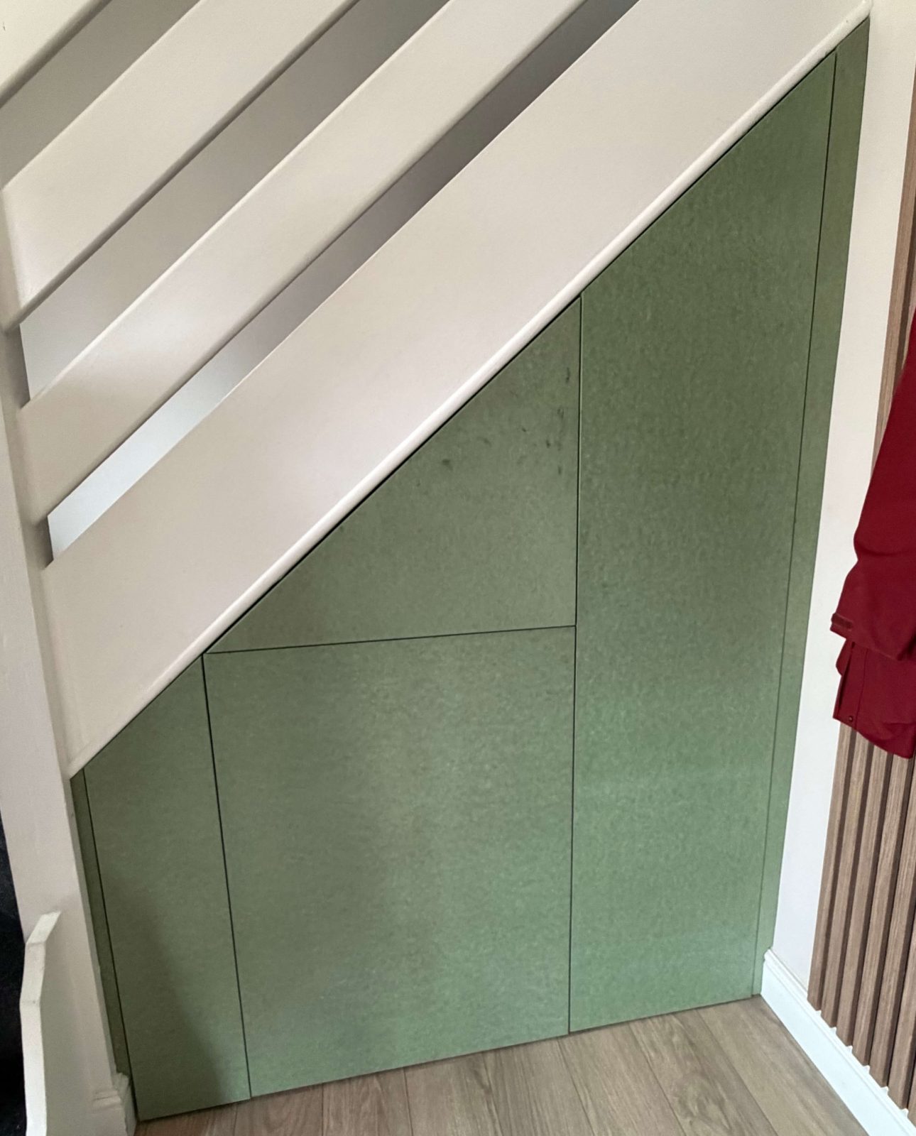 Fitted understairs storage with handleless cupboard doors Cambridgeshire.