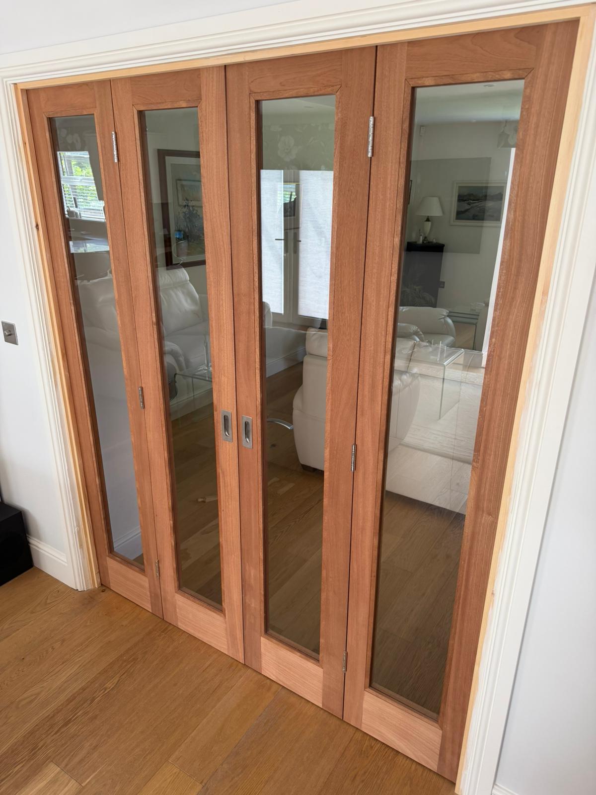 Bespoke sapele bi-fold doors fitted in a home in March, Cambridgeshire.
