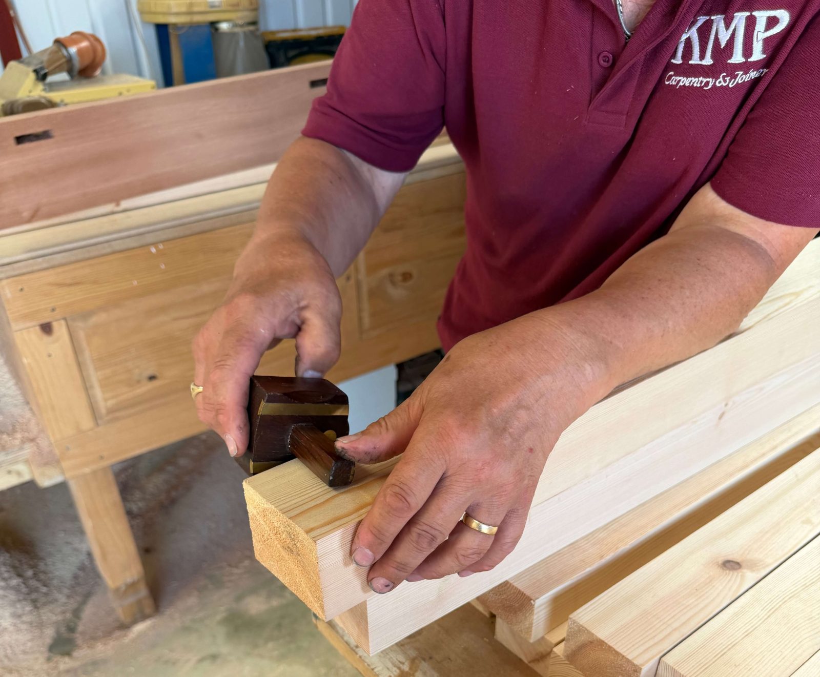 Joinery using traditional methods in carpentry and joinery workshop.