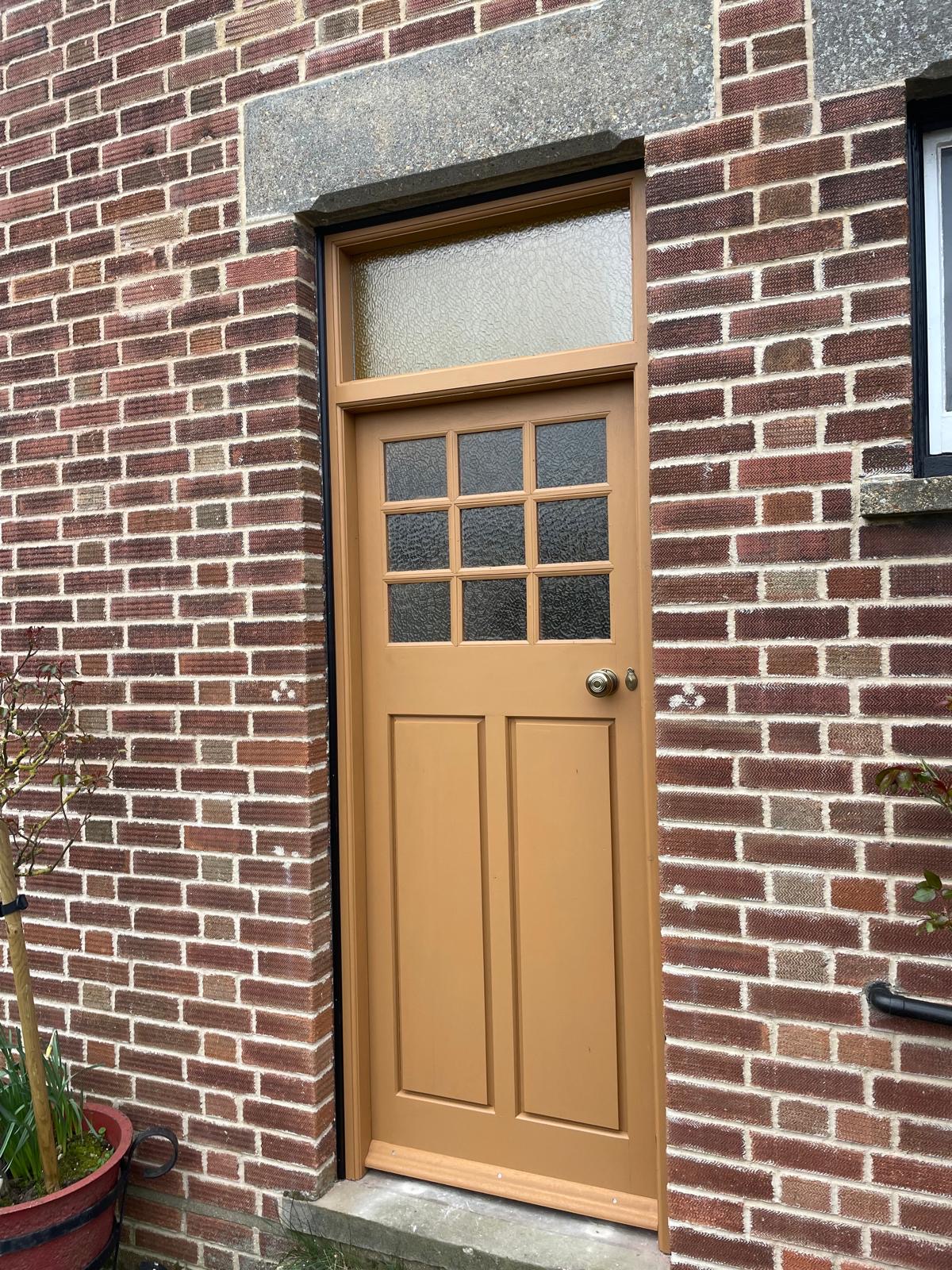 Traditional timber entrance door installed on a period property in Cambridgeshire.