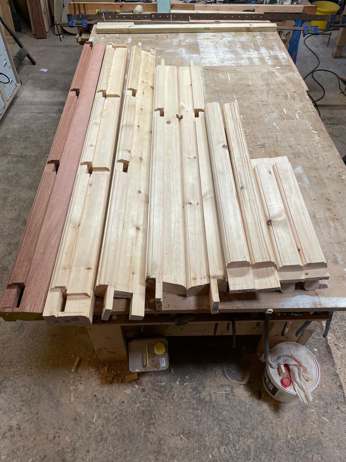 Traditional timber window components marked out and prepared in the KMP Carpentry & Joinery workshop before assembly using traditional mortise and tenon joints.